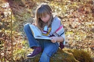 Young girl reading a book.